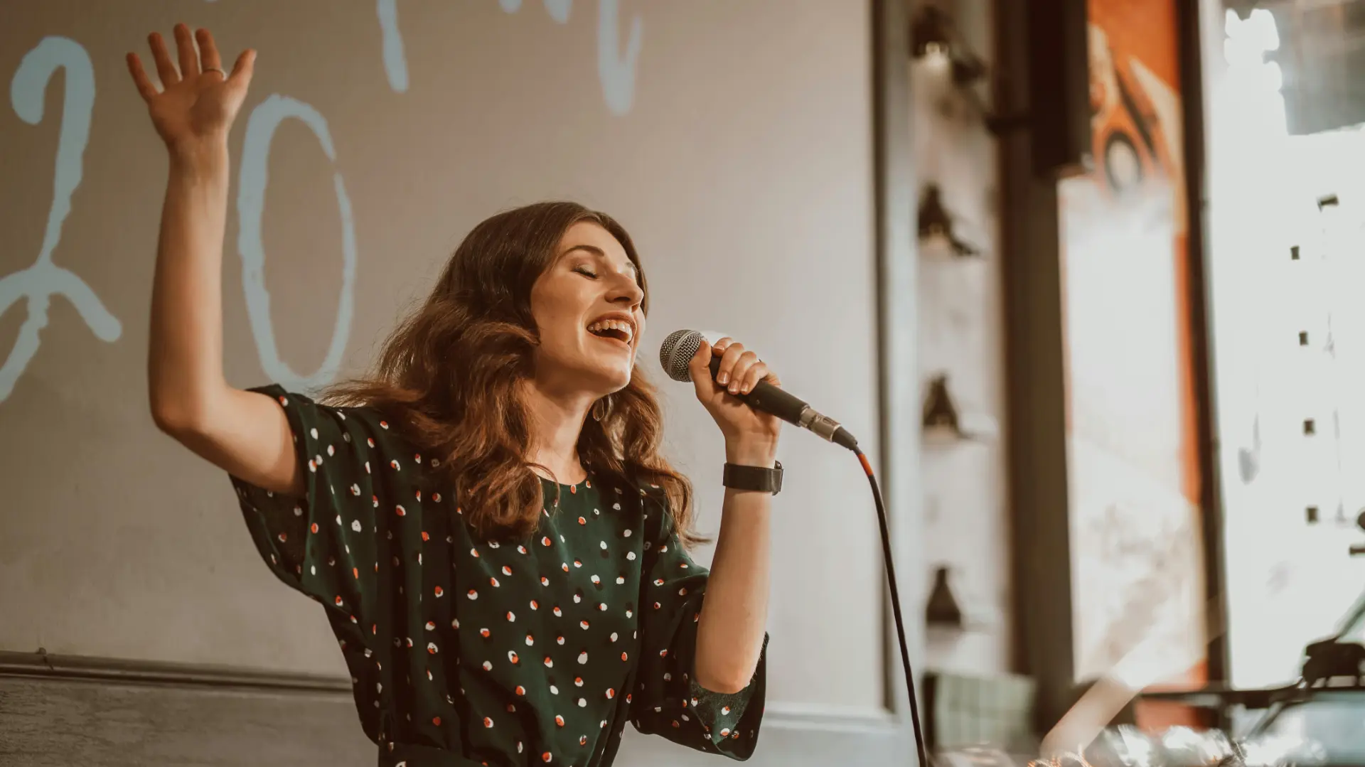 A vocalist performing with a microphone
